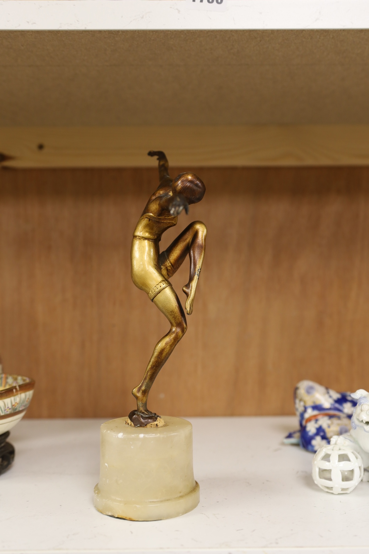 A gilt patinated spelter dancing figure after Chiparus, 27cm high. Condition - front of base of figure at the feet broken